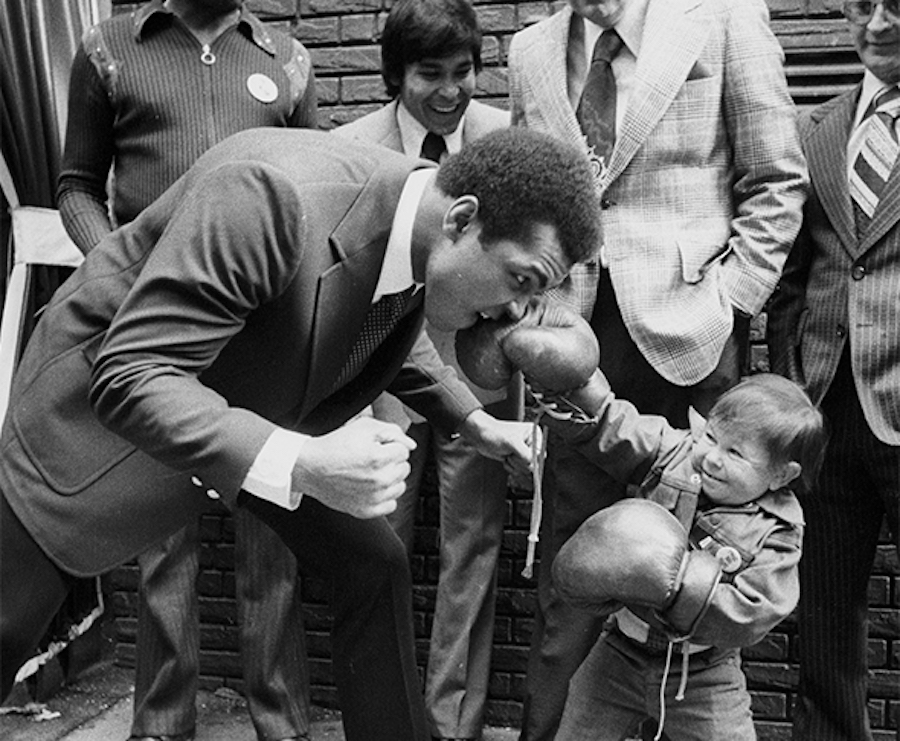 muhammad ali playing with asian child